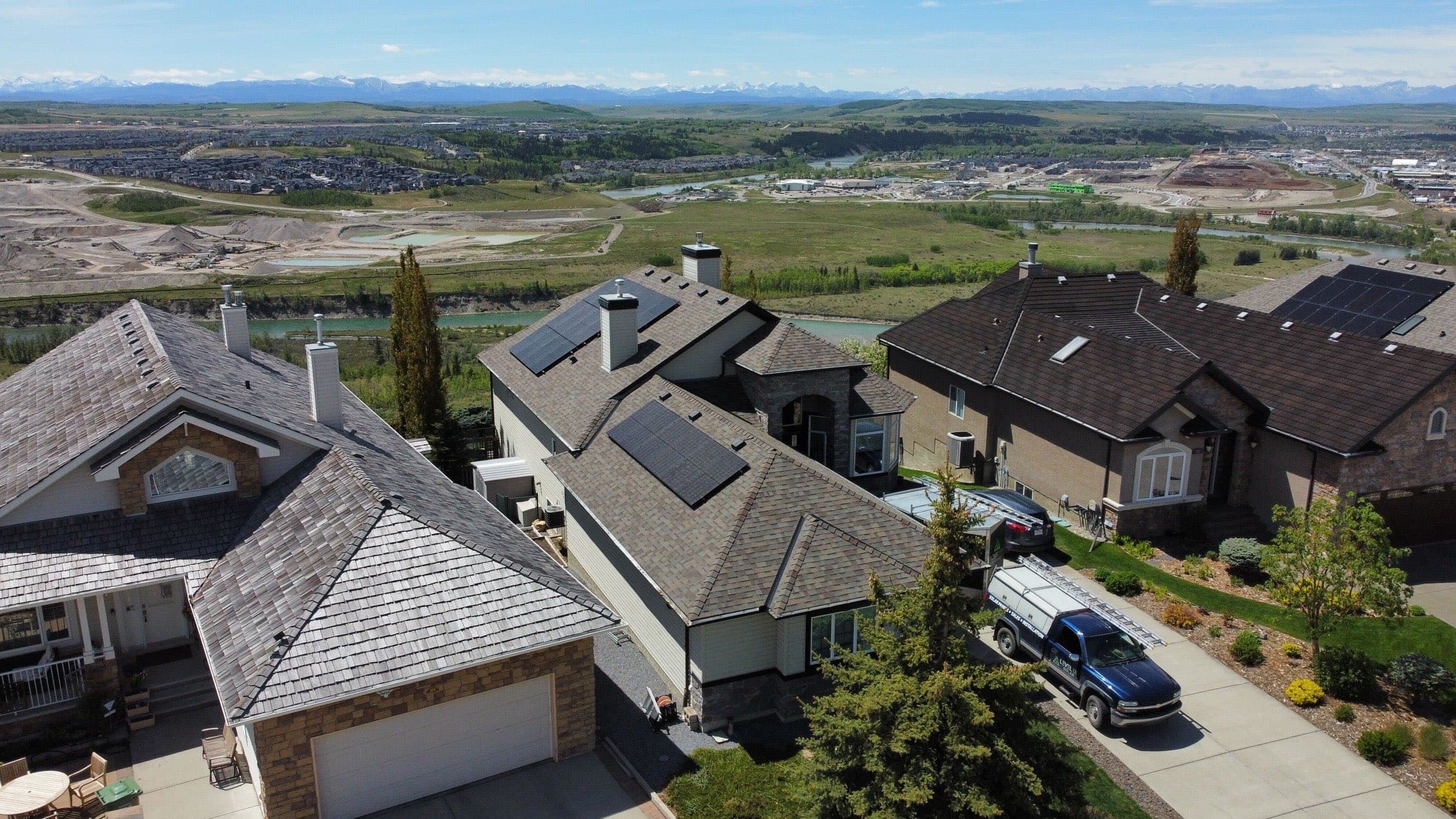 A 10 kW solar array on a Glen Eagles home in Cochrane, with the foothills behind