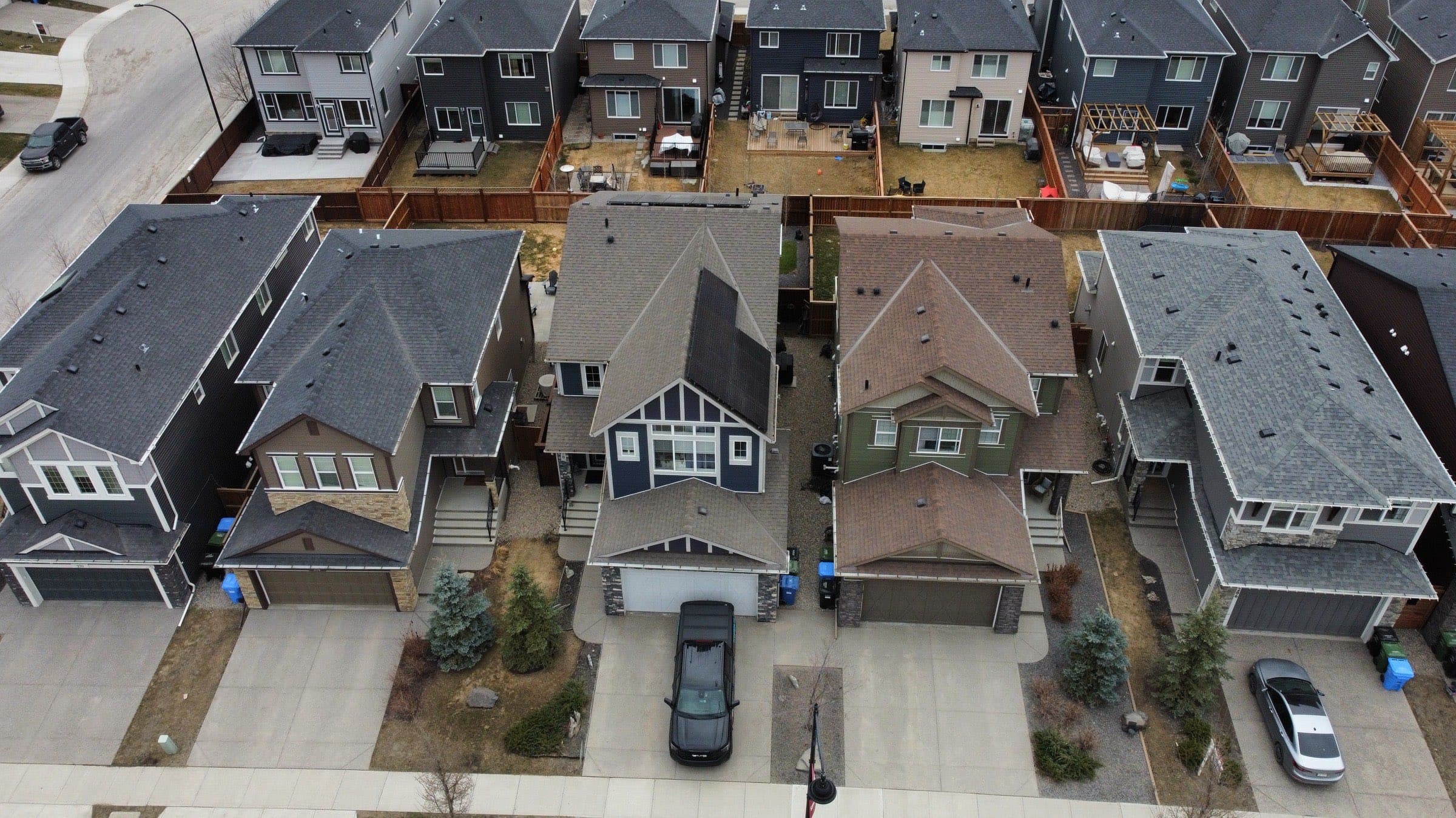 Rooftop solar array on a home at dusk, from above